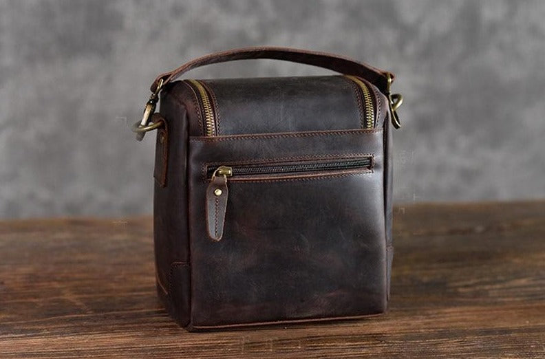 Small leather camera bag by Start2Finish, with a compact design, leather exterior, and camera lens case for accessories.