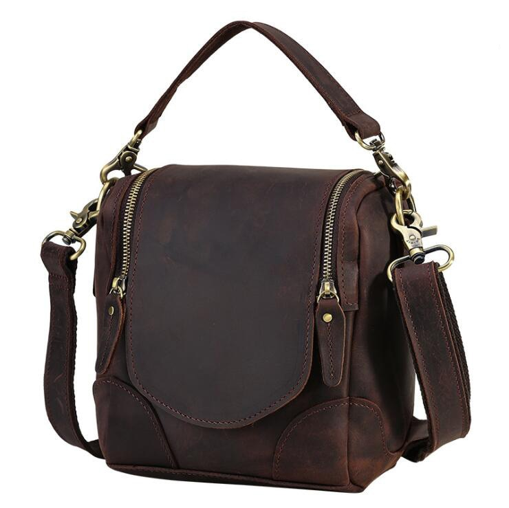 Small leather camera bag by Start2Finish, The Calista, with compact lens case design, featuring leather exterior and adjustable strap.