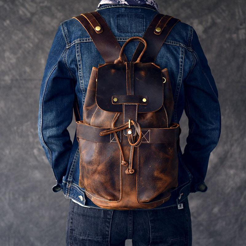 Olaf Rucksack vintage leather travel backpack by Start2Finish, showing sturdy straps and spacious interior for accessories and travel essentials.