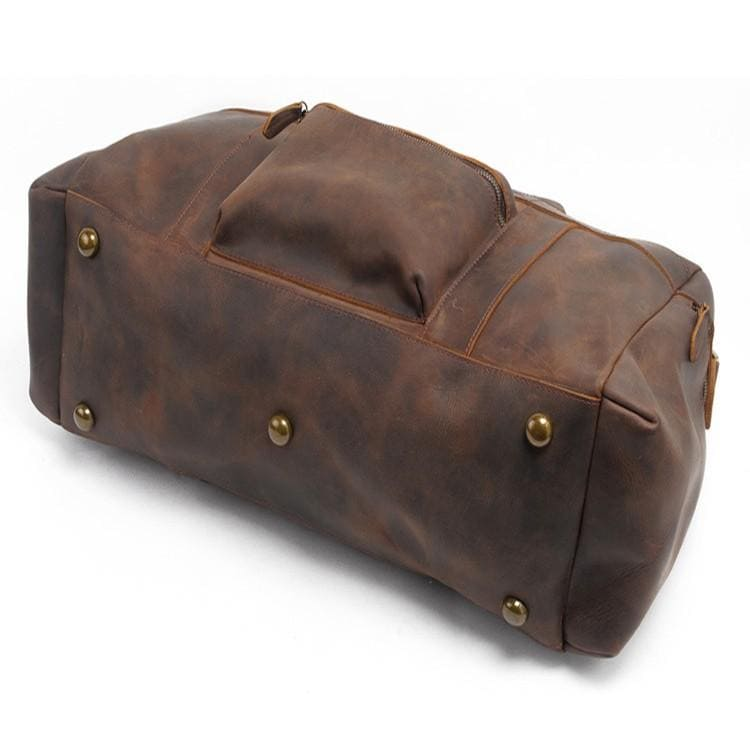 Handcrafted leather Asta Weekender duffle bag from Start2Finish, showing its spacious design and sturdy leather handles.