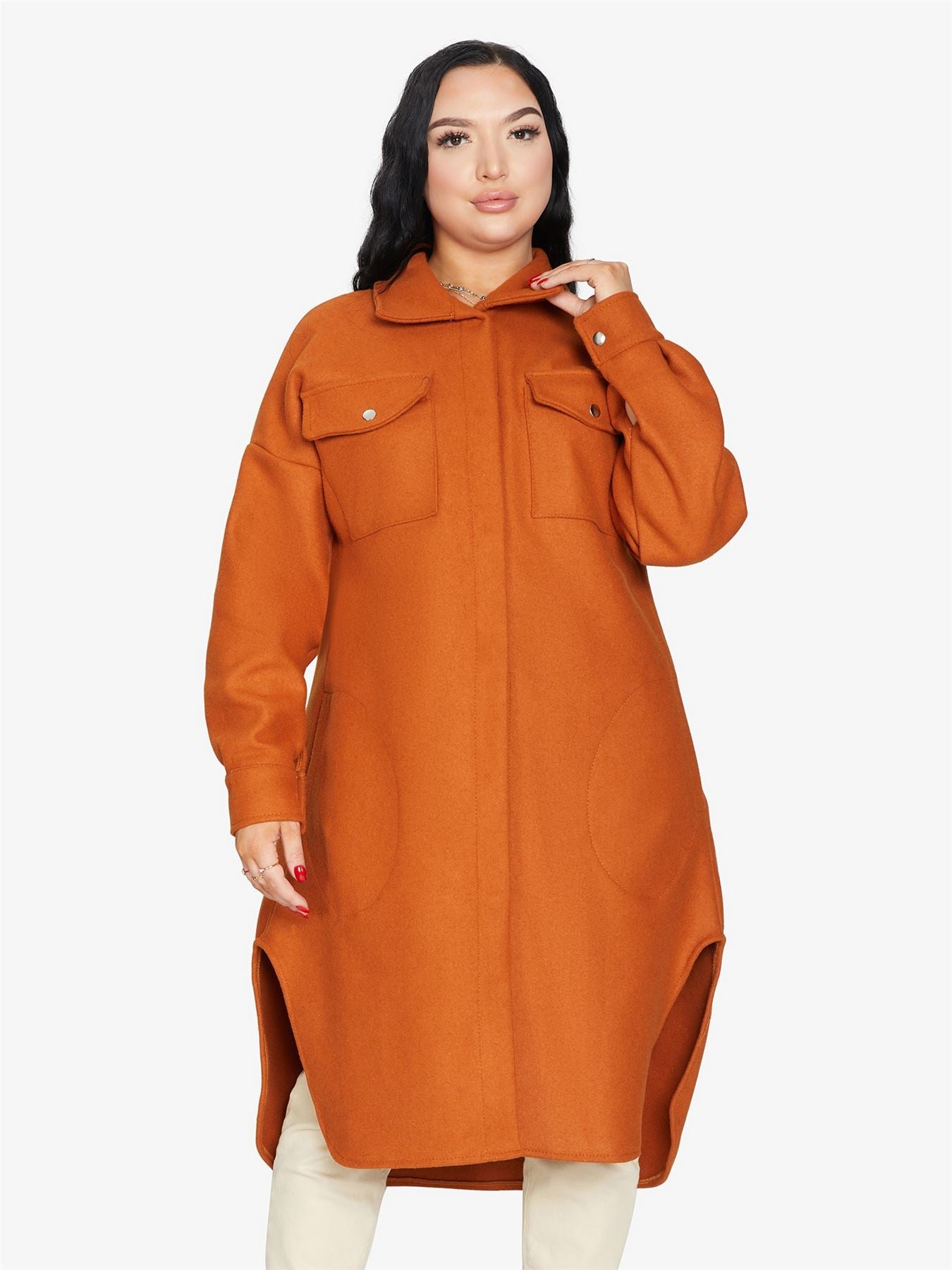 Rose Eleusis oversized longline shacket in neutral fabric, layered over casual outfit, showing relaxed fit and stylish design.