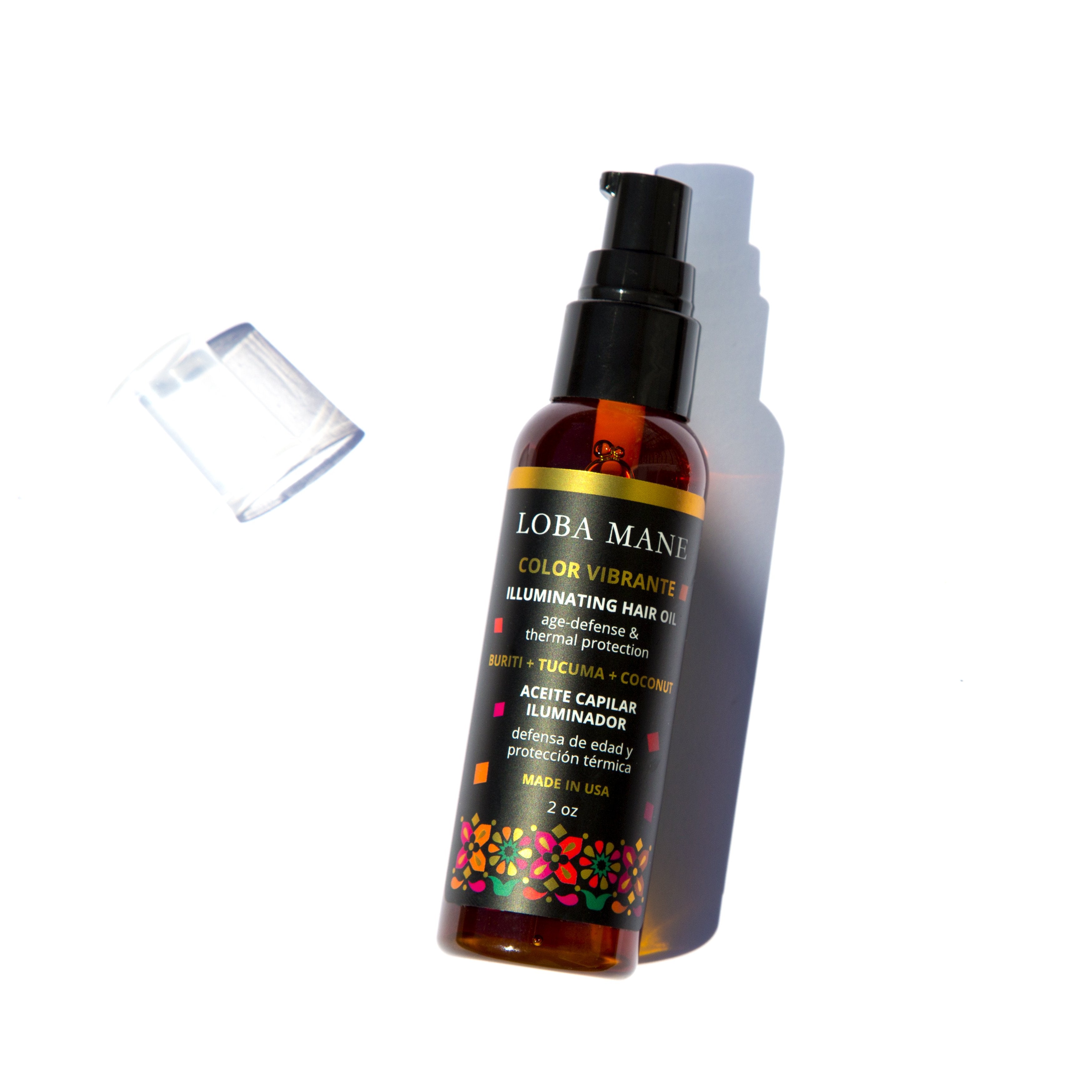 Ivory Pandora Illuminating Oil for hair, showing a sleek bottle with the product label and a shiny, smooth hair strand.