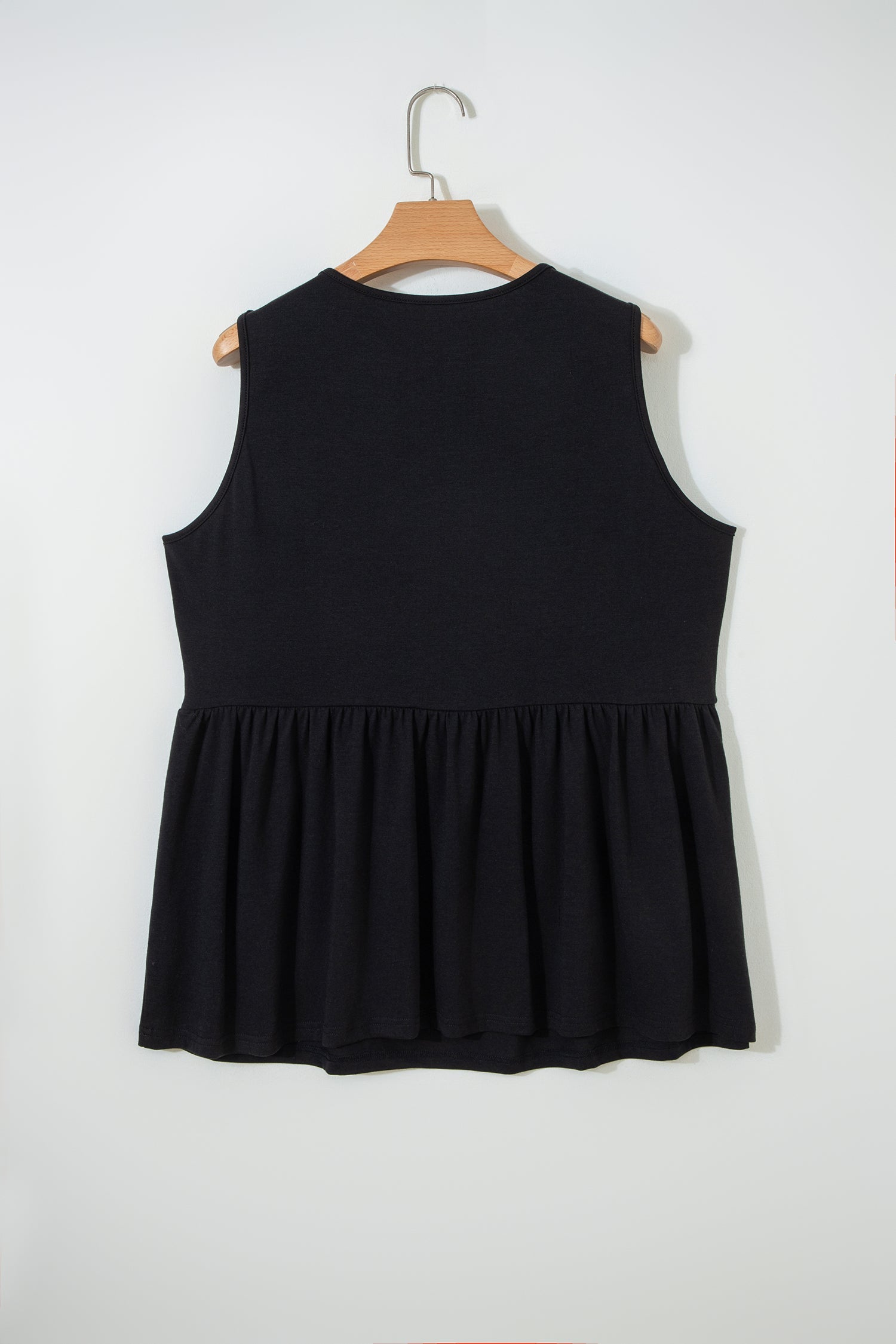 Plus size solid bow-tie peplum tank top from Byzantium Bay featuring a stylish sleeveless design and flattering fit.