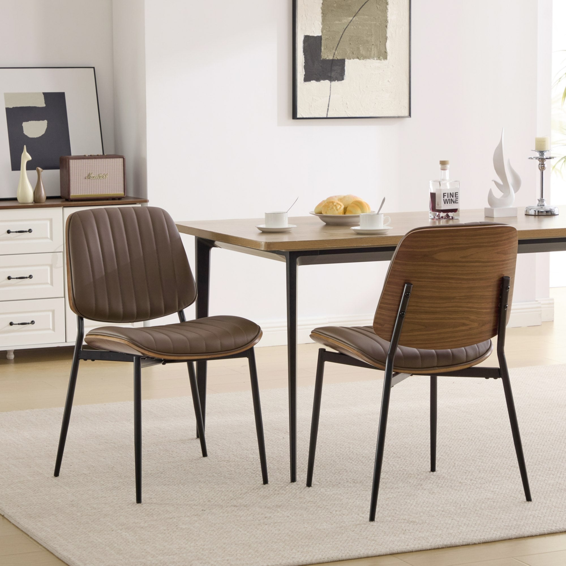 Set of 2 mid-century modern dining chairs with walnut bentwood backs, metal legs, and upholstered seats for kitchen and dining room.