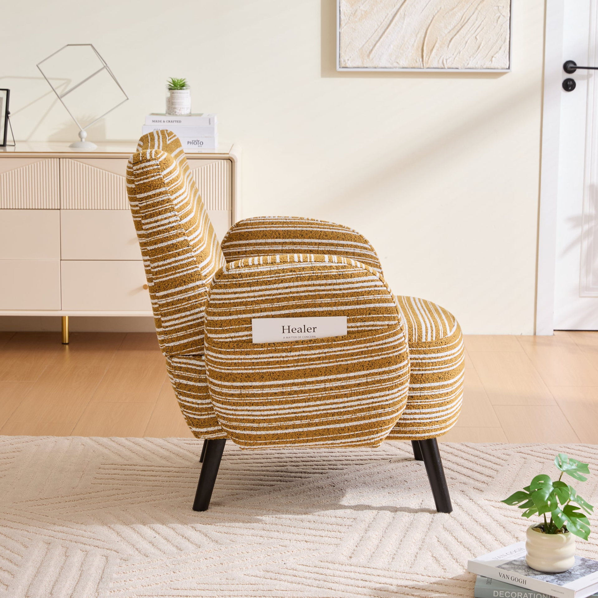 Modern armchair with sanded fabric, solid wood legs, and a side storage pocket by Start2Finish, showcasing a stylish and functional design.