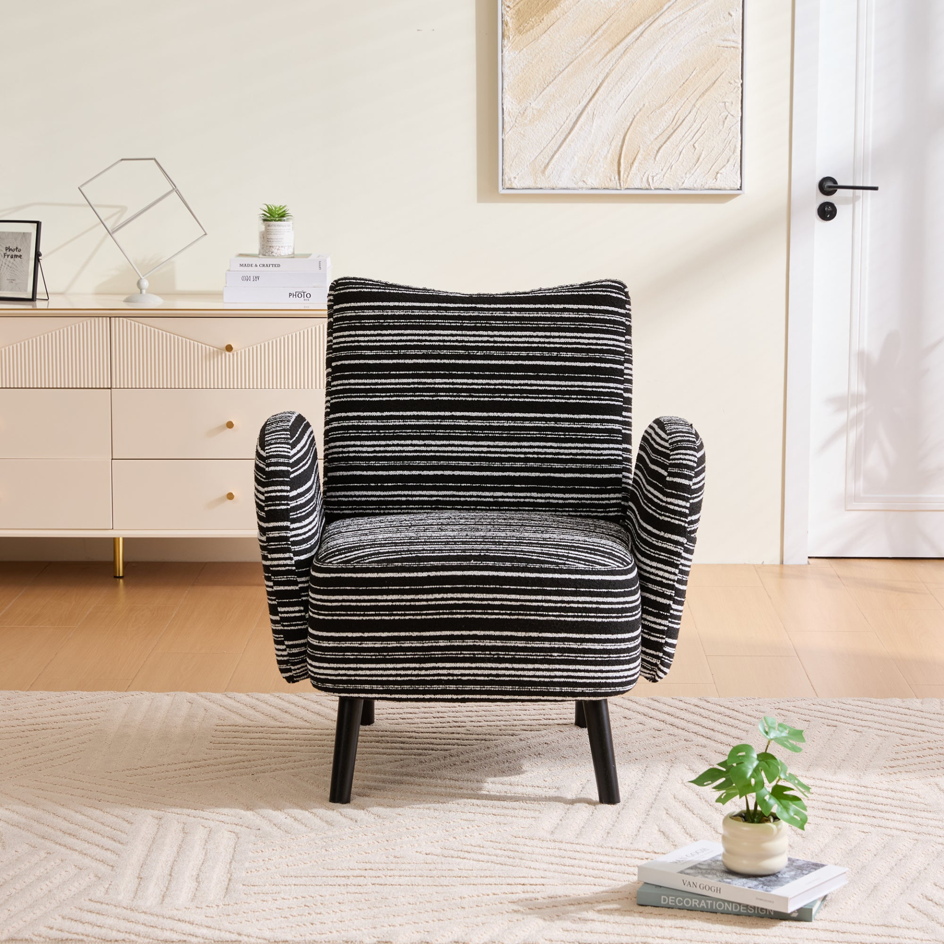 Modern armchair by Start2Finish with sanded fabric, side storage pocket, and solid wood legs, shown in a living room setting.