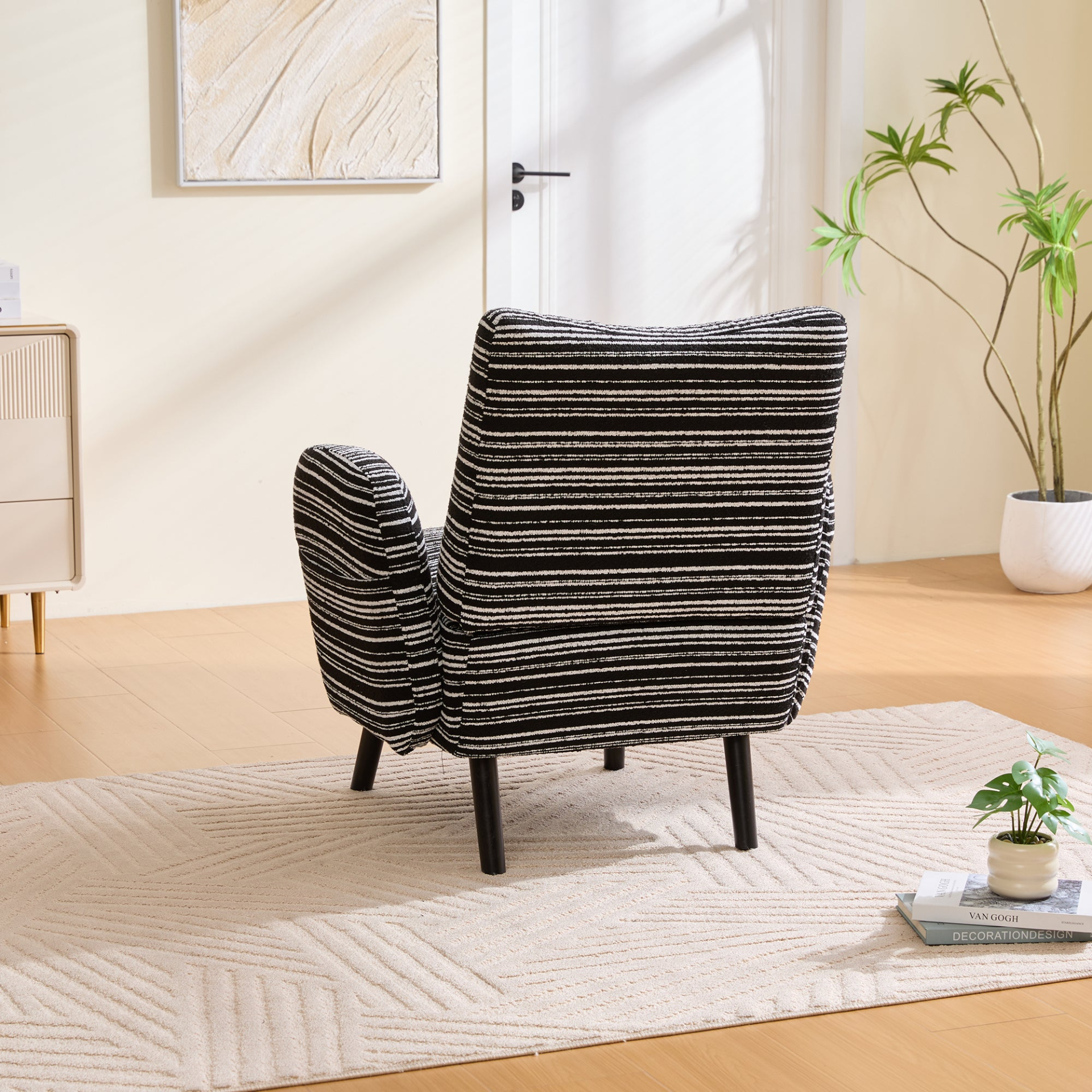 Modern Start2Finish armchair with sanded fabric, side storage pocket, and solid wood legs in a stylish living room setting.
