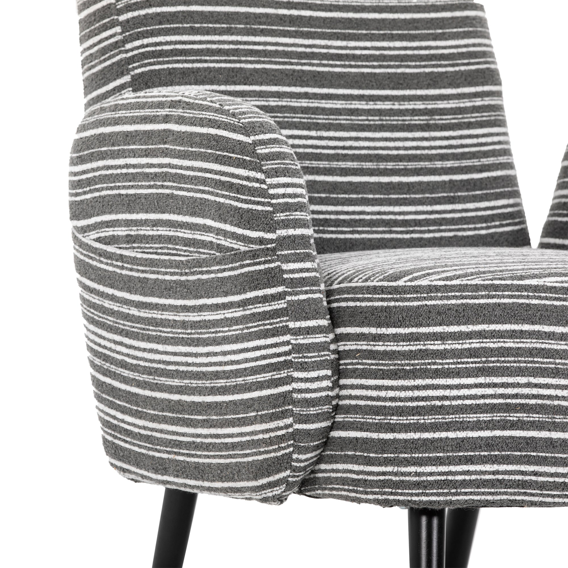 Modern armchair by Start2Finish with sanded fabric, side storage pocket, and solid wood legs in a stylish living room setting.
