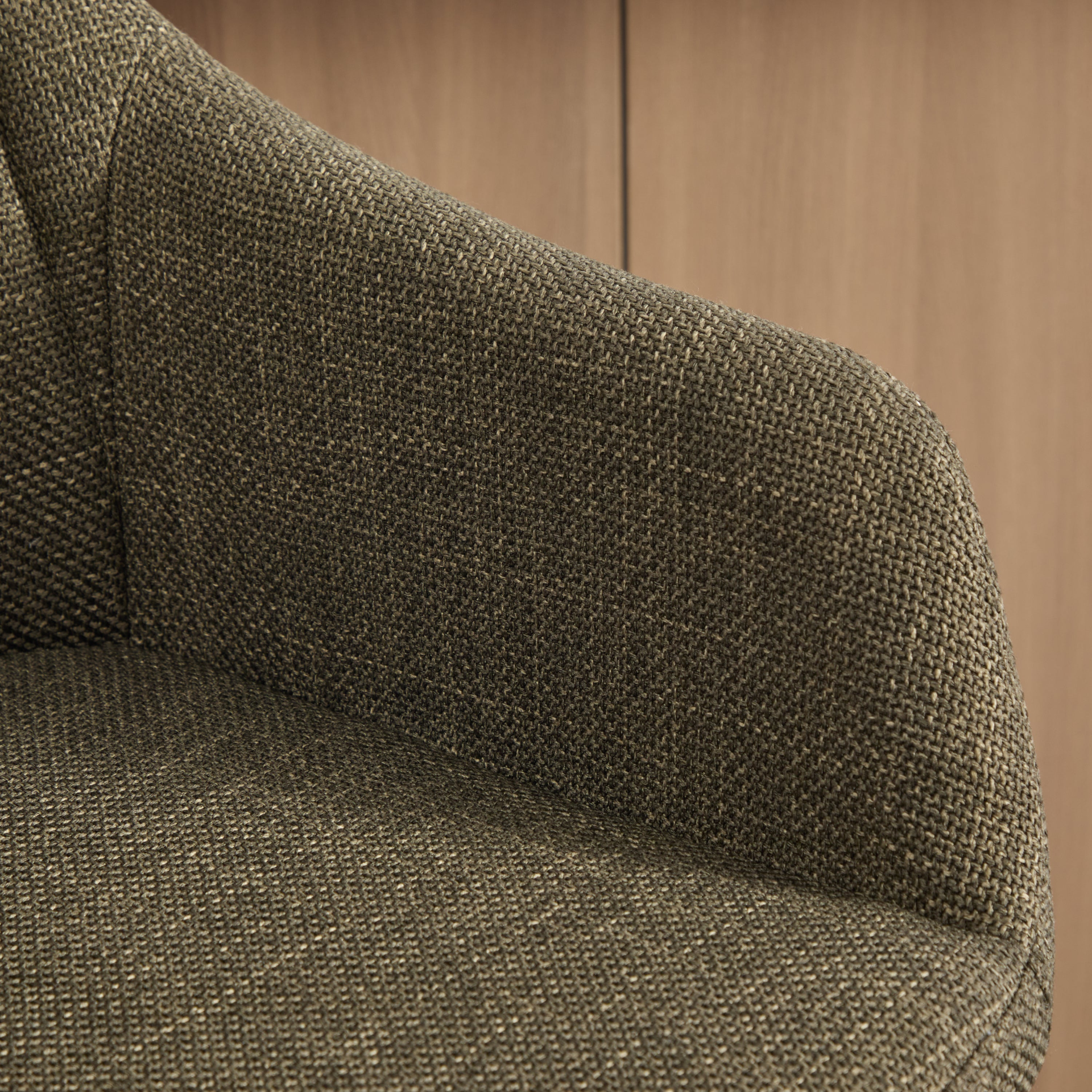 Modern linen upholstered bar stool with back, armrests, footrest, and solid wood legs from Start2Finish furniture.