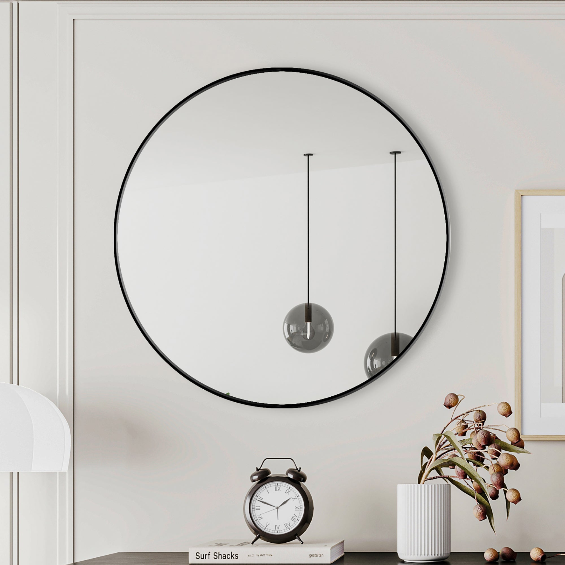 Round wall mirror with a metal frame, ideal for vanity and home decor, featuring a sleek circular design by Start2Finish.