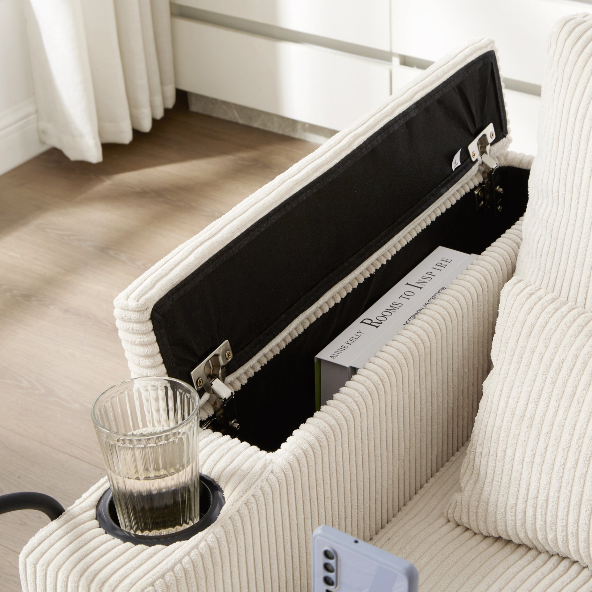 Start2Finish convertible chaise lounge sofa chair with USB ports, cup holders, phone holder, and storage in a modern living room.