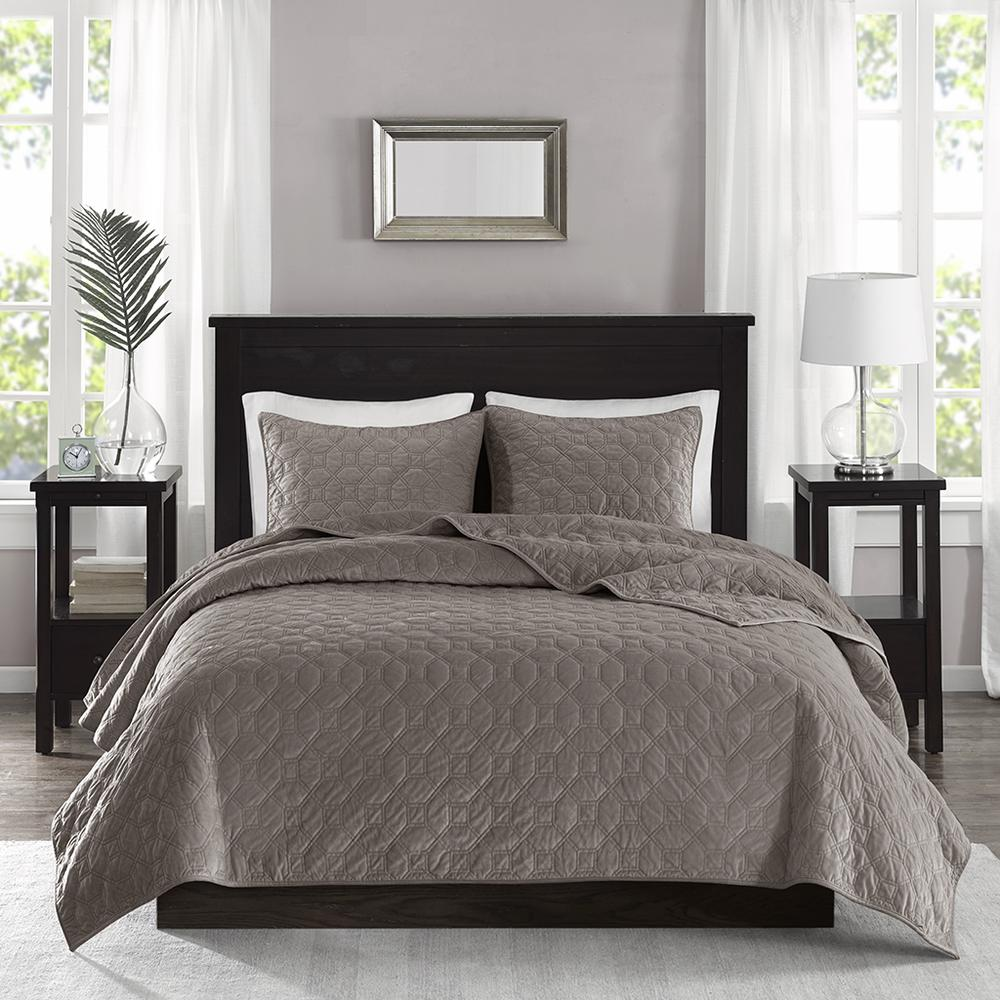 Start2Finish Harper 3-piece velvet quilt set in taupe with matching pillow shams on a bed.