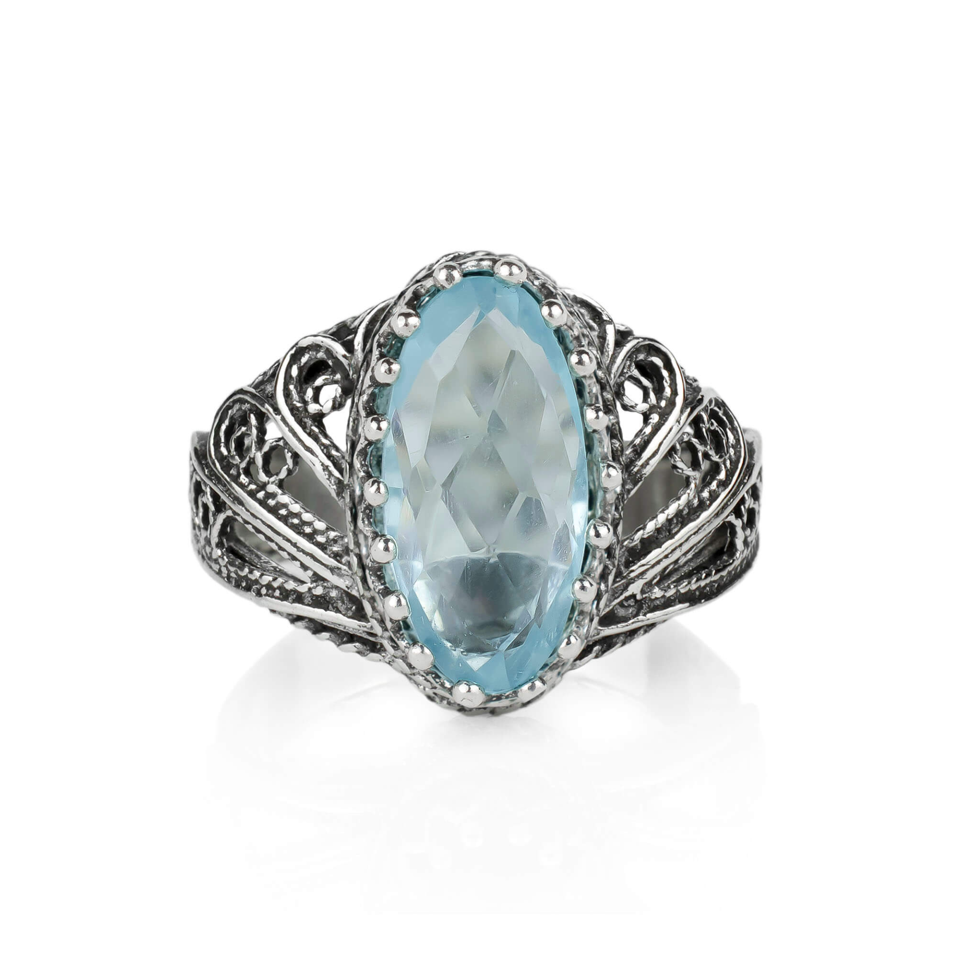 Silver cocktail ring featuring a filigree angel design with a blue topaz gemstone, crafted by Start2Finish for women.