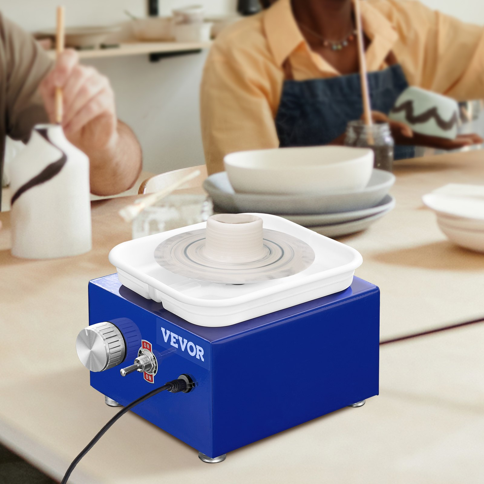 Blue VEVOR mini pottery wheel for kids and beginners with adjustable speed, ceramic turntables, basin, and 17 craft accessories.