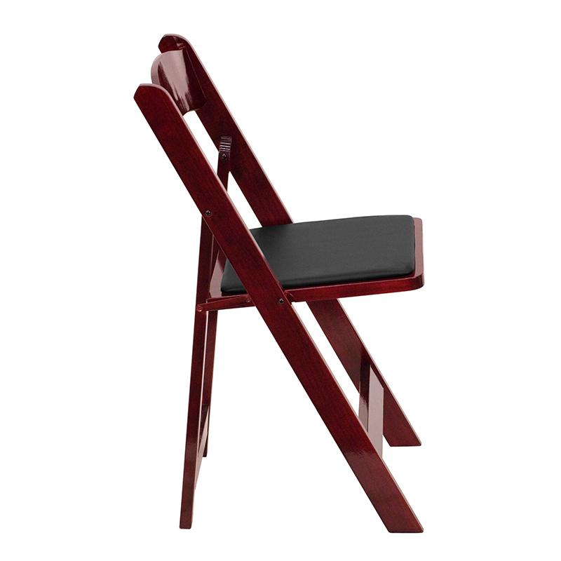 Two HERCULES Series mahogany wood folding chairs with vinyl padded seats, shown folded and open for versatile seating.