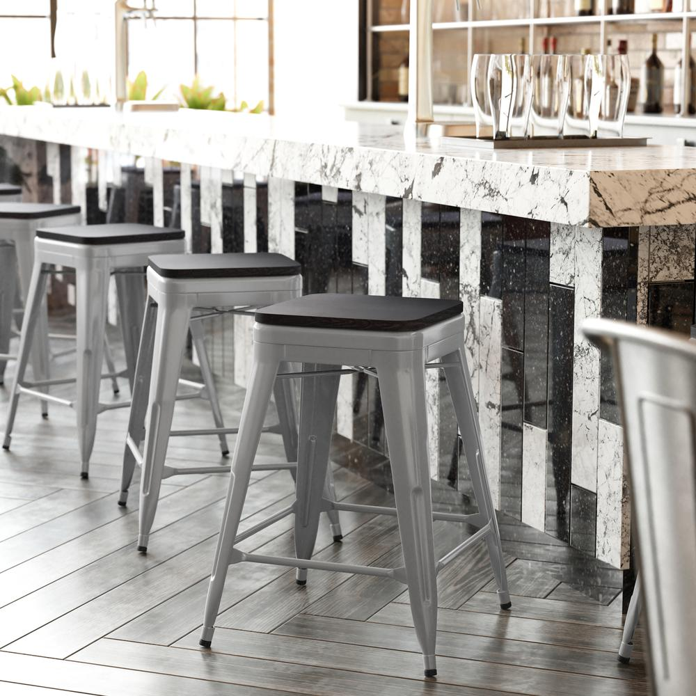 Set of four Start2Finish silver metal counter height stools with gray all-weather poly resin seats, high backless design, indoor use