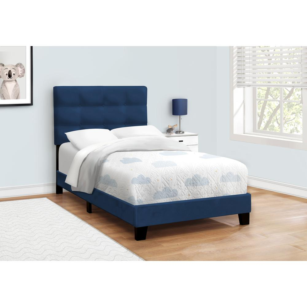Blue velvet twin size upholstered bed frame with a transitional design, featuring a sturdy wooden structure and padded headboard.