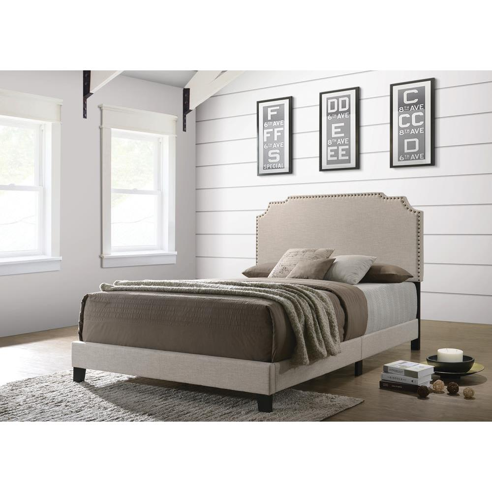Start2Finish Tamarac beige upholstered full panel bed with padded headboard and frame, shown in a bedroom setting.