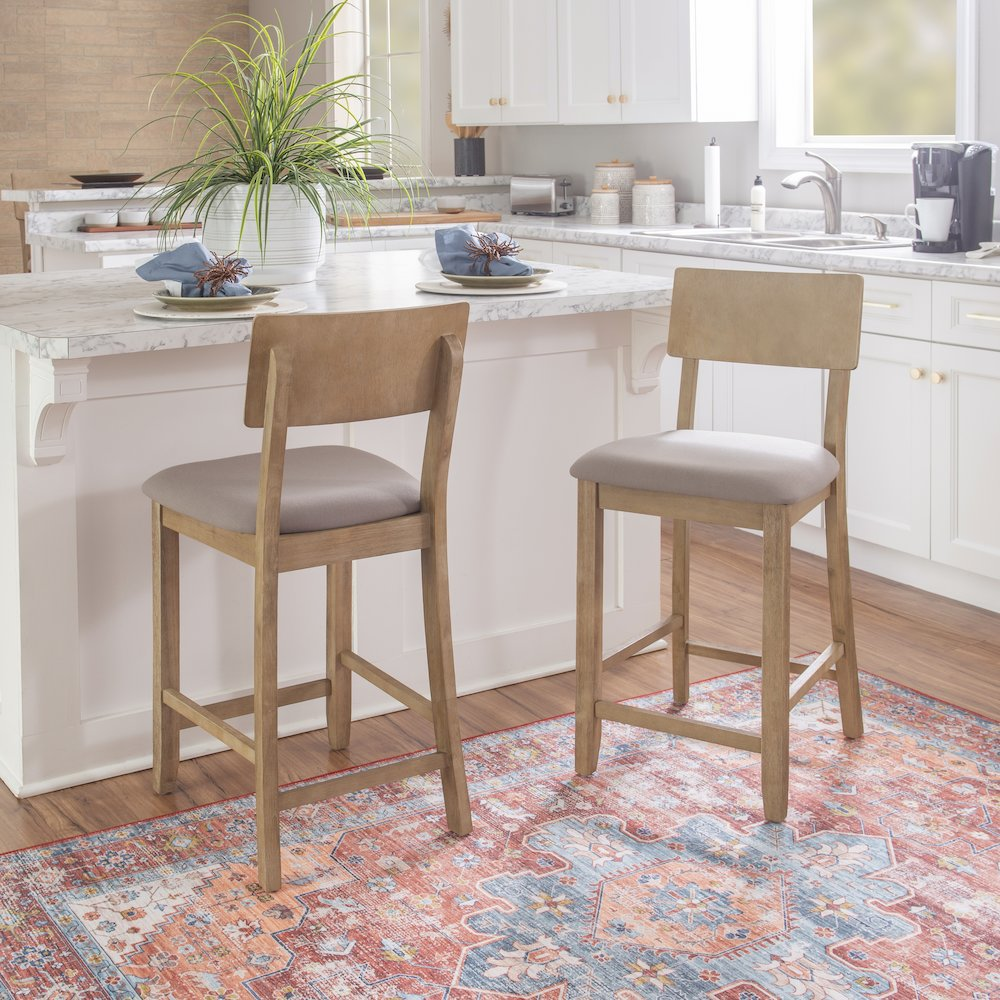 Gray wash Jordan 24-inch counter stool with wooden legs and a cushioned seat, designed for stylish seating.