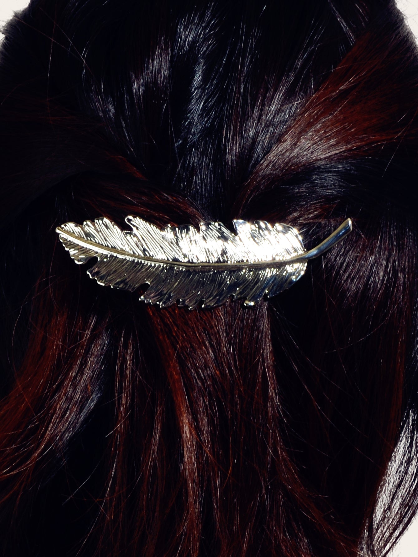 Gold and silver feather metal hair grips and clips by White Demeter, stylish hair accessories for elegant hair styling.