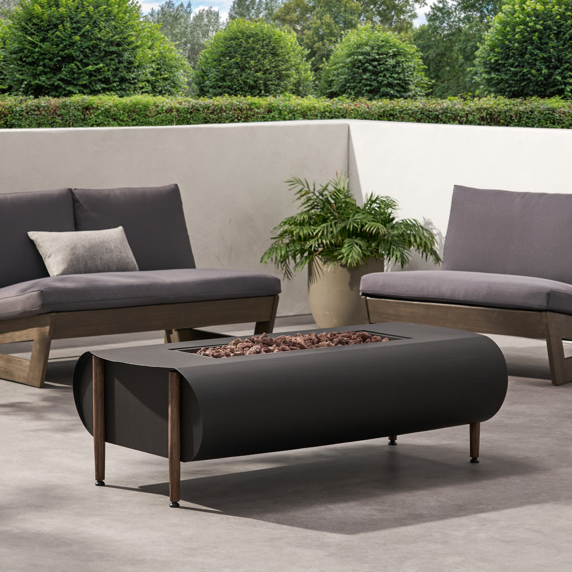 Dark gray iron fire pit table with tank holder, ideal for outdoor patios and living spaces, by Start2Finish.