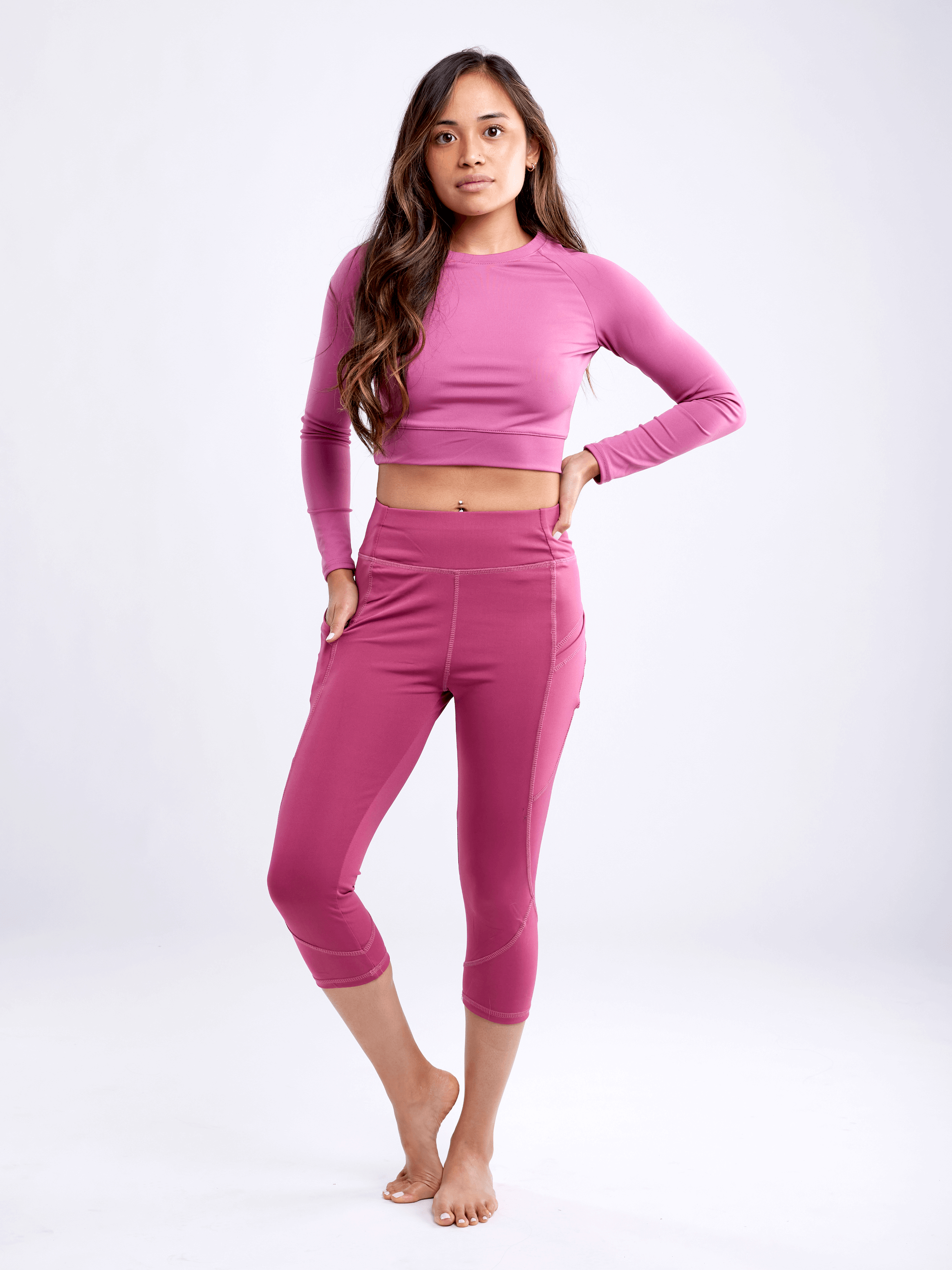Black Lavender JupiterGear long-sleeve crop top, activewear with a fitted design and stylish neckline, shown on a model.