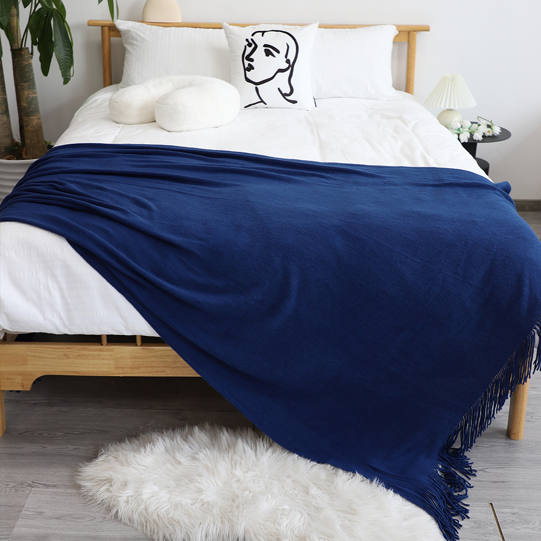 Royal blue acrylic throw blanket by Start2Finish, soft and cozy home accessory shown folded with textured fabric.