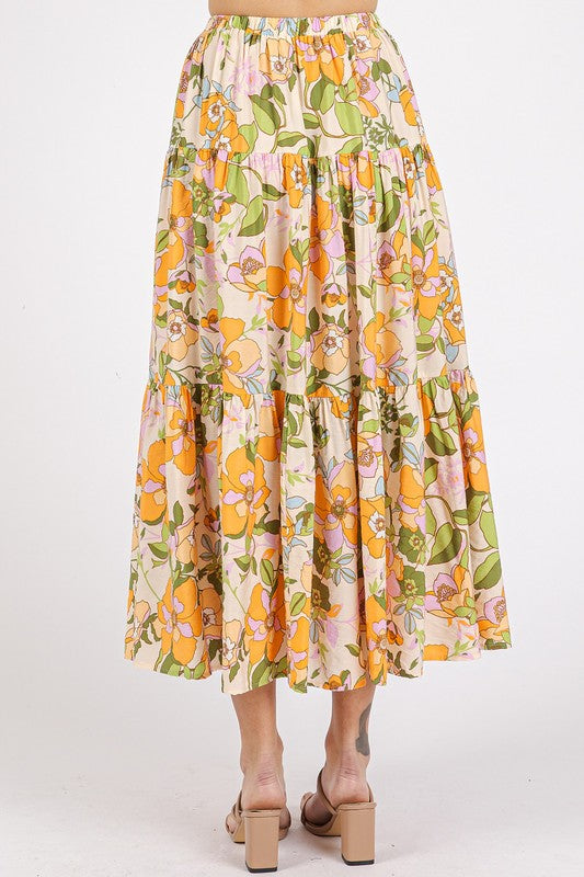 Pink flower print elastic waist tiered skirt from Jade Icarus, featuring a flowing design and floral pattern.