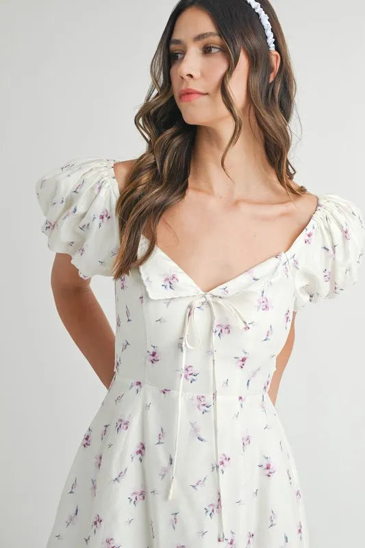 Pear Daisy floral print puff sleeve mini dress with a vibrant floral pattern, perfect for stylish summer wear.