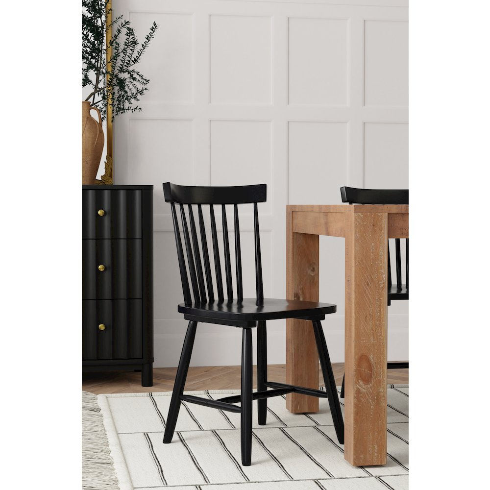 Set of 2 black Lyra side chairs by Start2Finish with sleek modern design and sturdy metal frames, shown from a front angle.