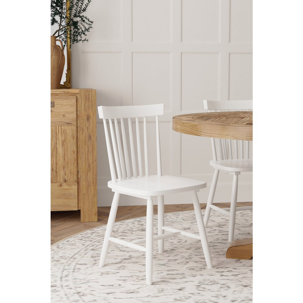 Set of 2 white Lyra side chairs by Start2Finish, modern furniture with sleek, minimalist design and smooth finish.