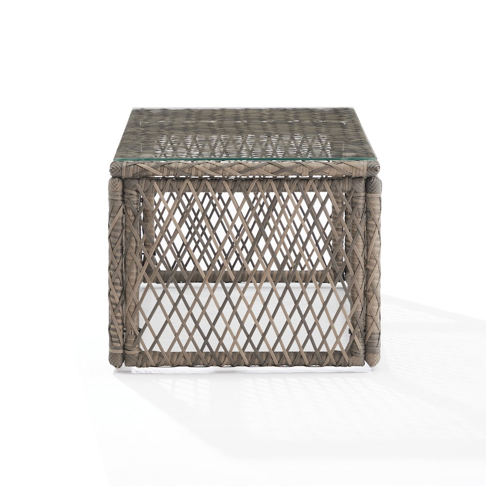 Start2Finish Granite Bay wicker outdoor coffee table with a flat top and woven wicker base in a patio setting.