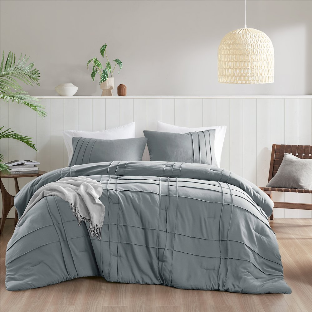 Start2Finish Porter soft washed bedding comforter set in blue and grey with pleated design, shown on a bed.