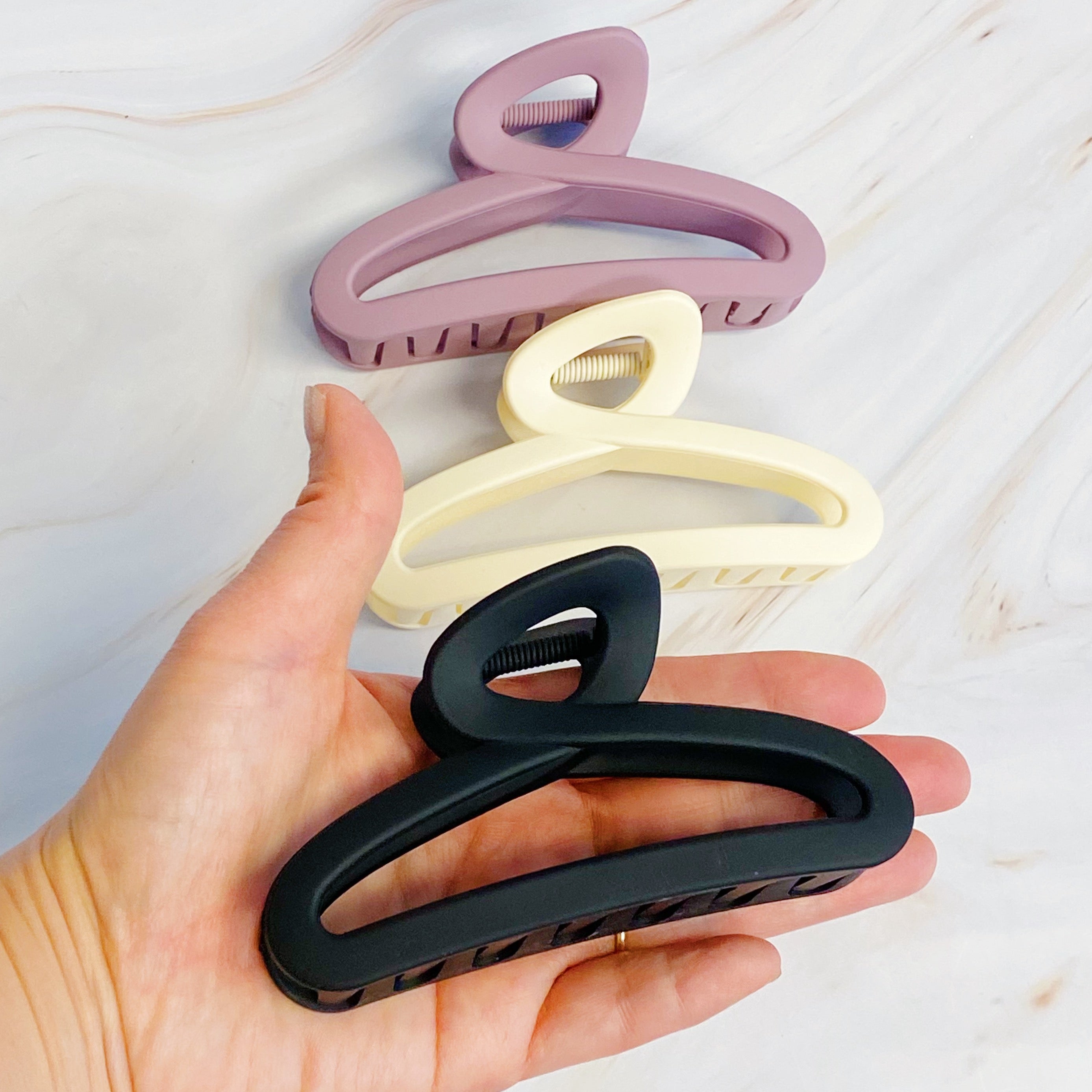 Fuchsia Hercules Hold Your Hair claw set of 3 hair clips in various sizes, stylish and functional hair accessories.