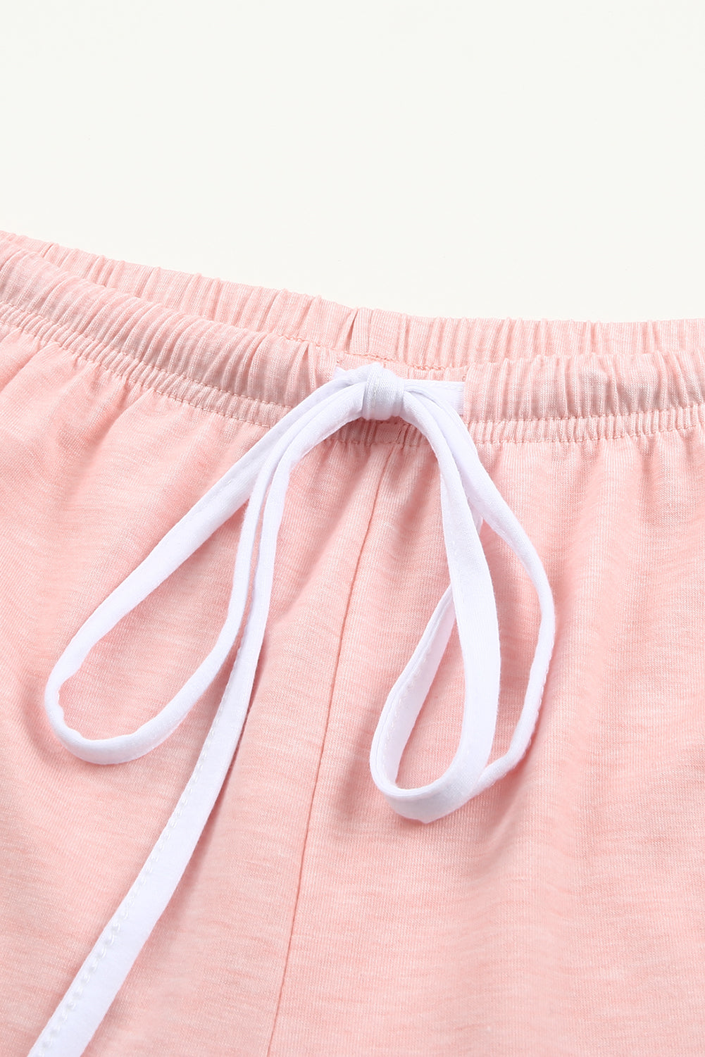 Pink leopard print short sleeve T-shirt and drawstring shorts from Harlequin Daisy, perfect for casual bath and beauty wear.