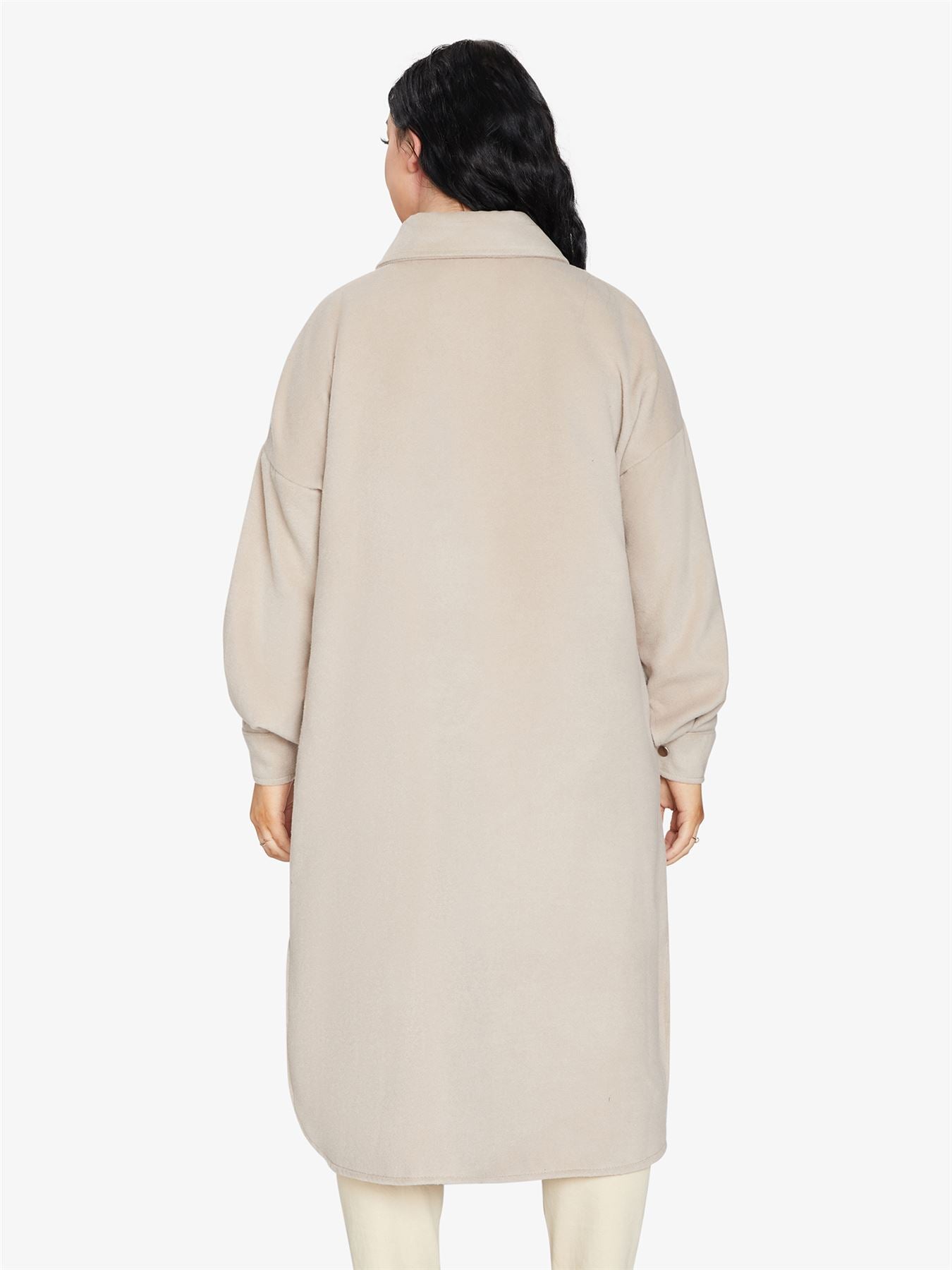 Rose Eleusis oversized longline shacket in neutral fabric, featuring a relaxed fit, button closure, and side pockets.