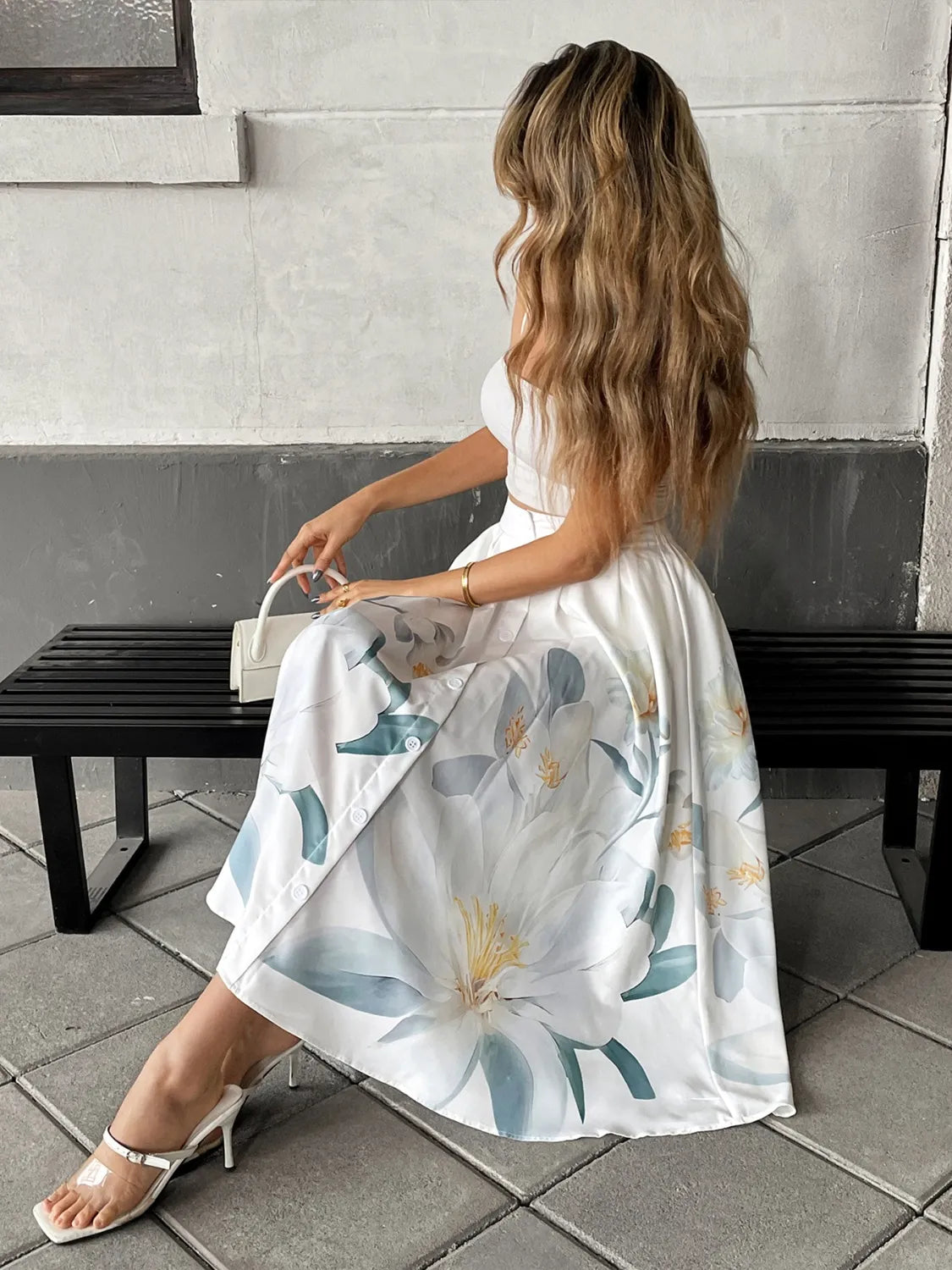 Floral print midi skirt by Ruby Styx for women, featuring a flowy design with vibrant flower patterns.