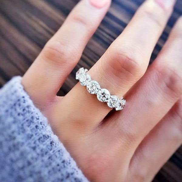 Start2Finish 4.00 Ct round cut created moissanite eternity band in 14k gold overlay, showcasing sparkling gemstone design.