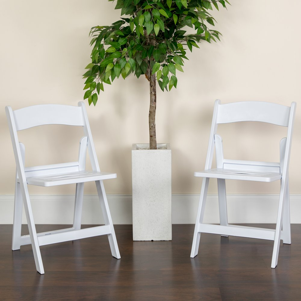 Two white resin folding chairs with slatted seats from the HERCULES Series, 1000 lb. capacity, by Start2Finish.