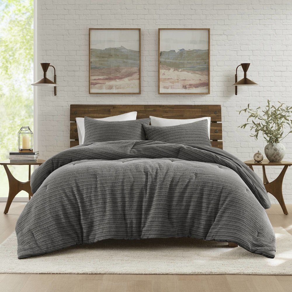 Lyon Waffle Washed Comforter Set in charcoal color with textured waffle pattern, designed for a cozy bedroom look.
