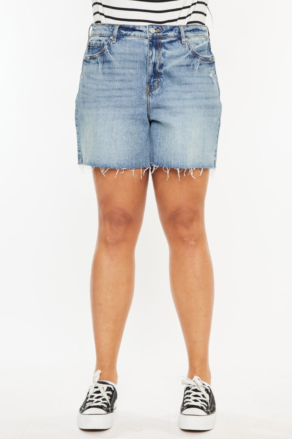 Jade Icarus Kancan high waist denim shorts with raw hem, showcasing distressed details and classic blue denim fabric.