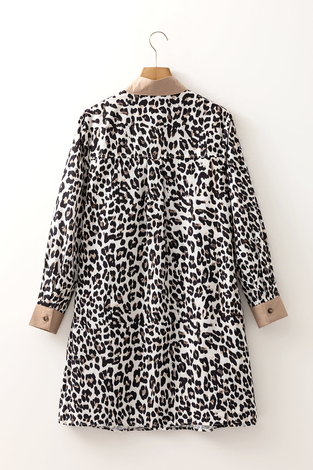 Leopard and stripe patterned Byzantium Bay long sleeve flared dress with a collar and fitted waist, stylish and elegant for any occasion.