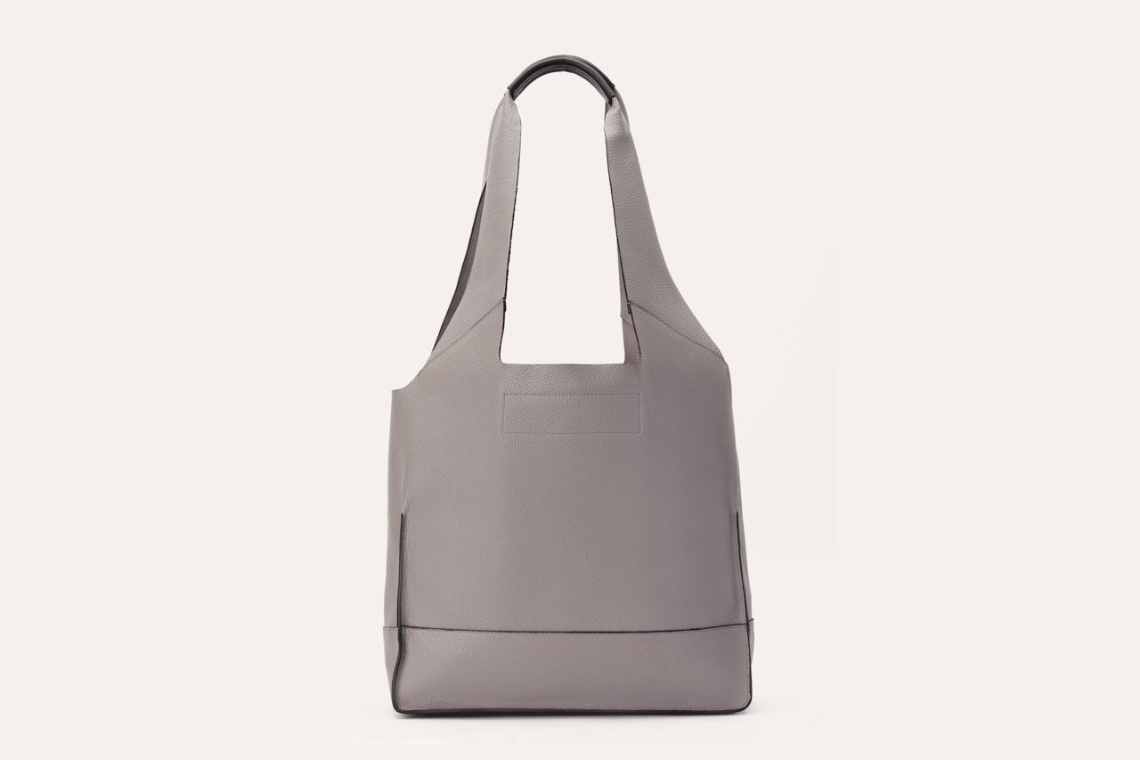 Pink Lucy modern tote bag, stylish accessories with sturdy handles and spacious interior, perfect for everyday use.