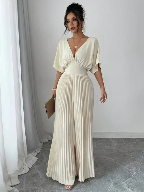 Carmine Juneberry pleated wrap-style maxi dress in 25th edition, featuring flowing fabric and elegant design.