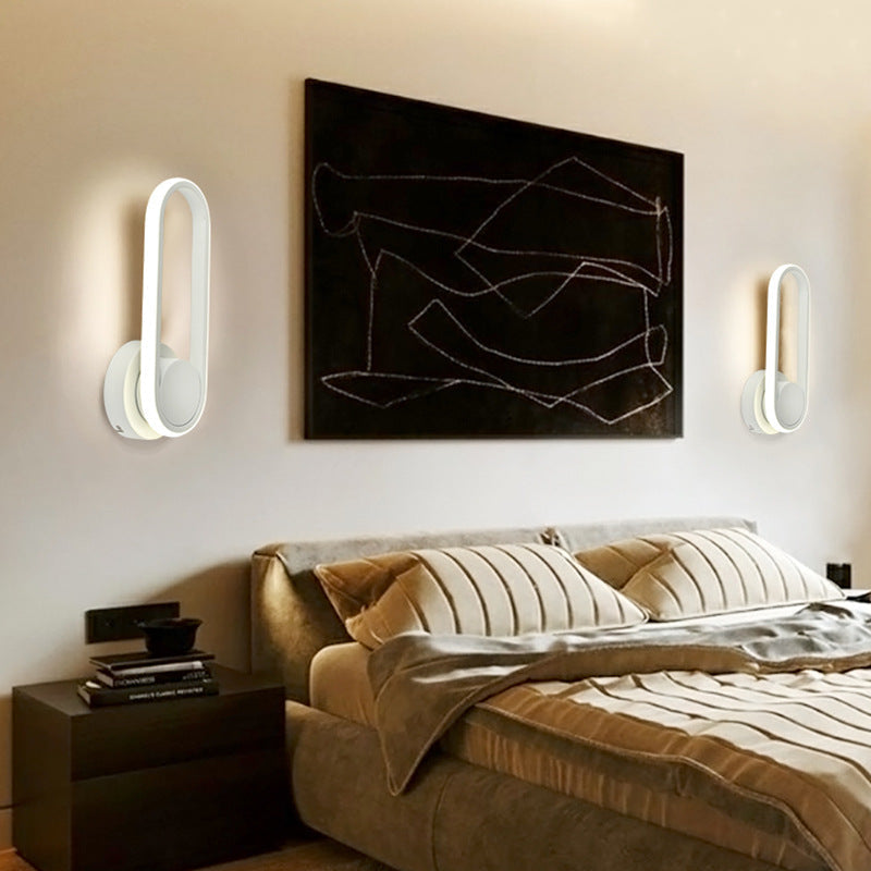 Maroon Asteria indoor bedroom wall lamp with rotatable acrylic LED design for ambient lighting and modern decor.