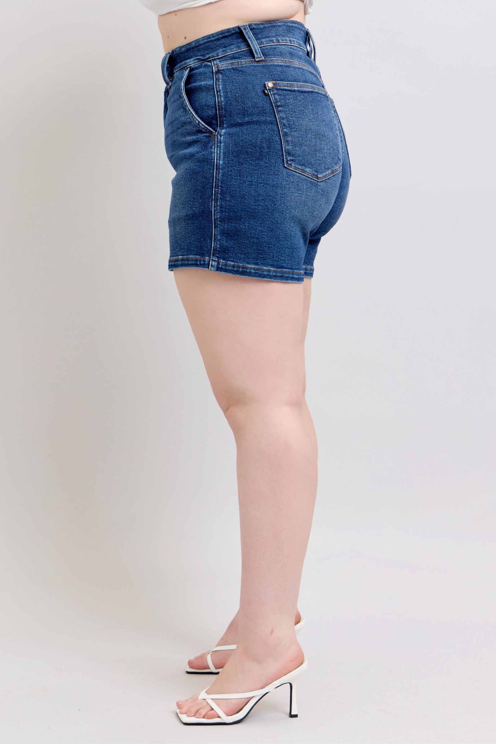 Judy Blue plus size denim shorts with double button waistband, showcasing classic blue denim and stylish fit.
