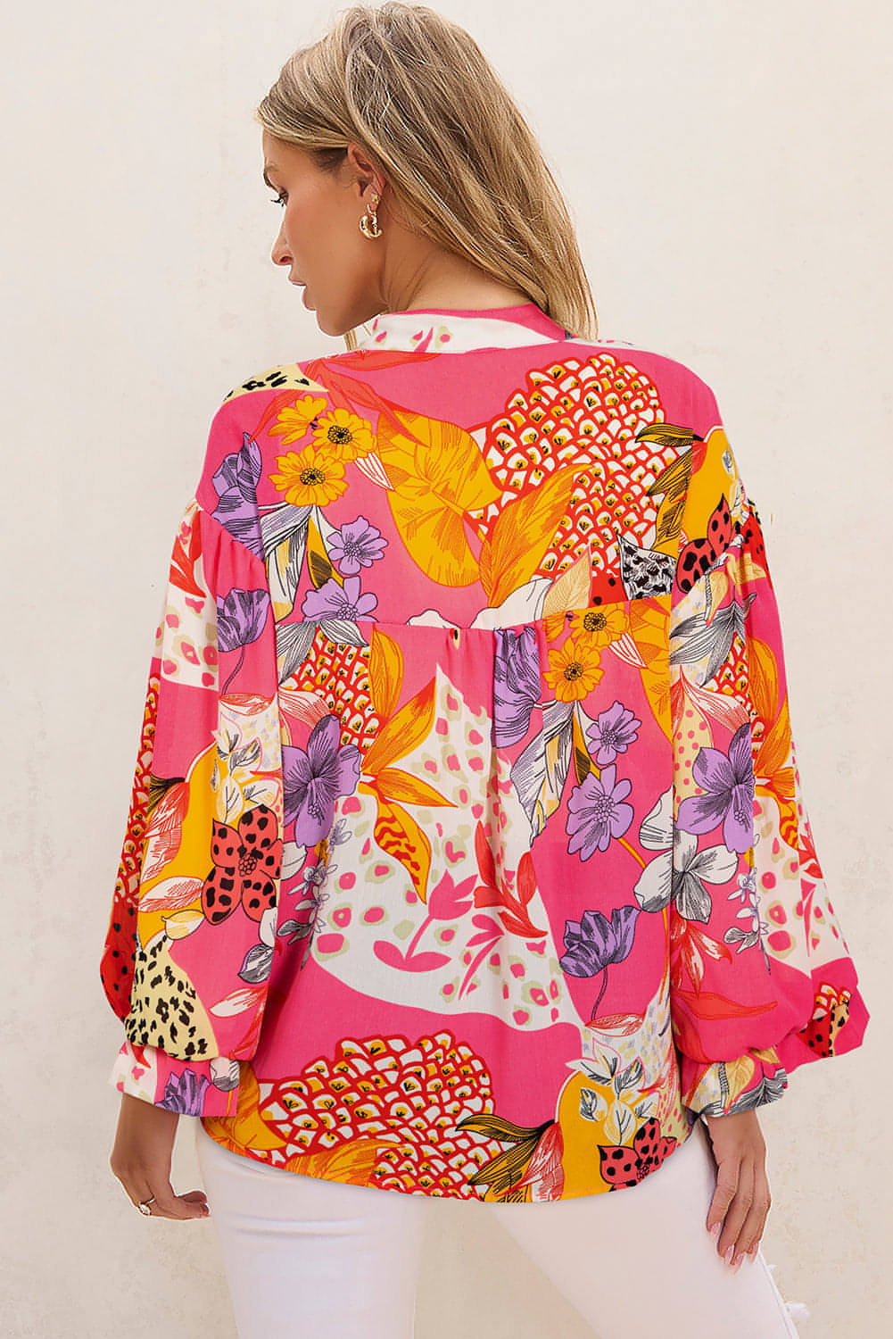 Red abstract floral print buttoned ruffled bubble sleeve blouse by Carmine Juneberry, featuring a stylish and feminine design.