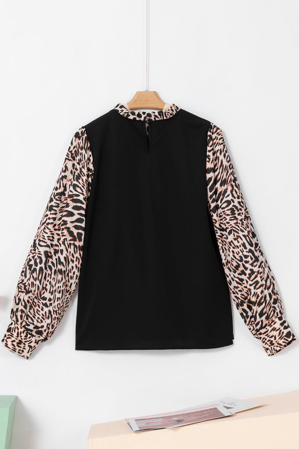 Black contrast leopard print lantern sleeve blouse by Carmine Juneberry, featuring stylish lantern sleeves and a comfortable fit.
