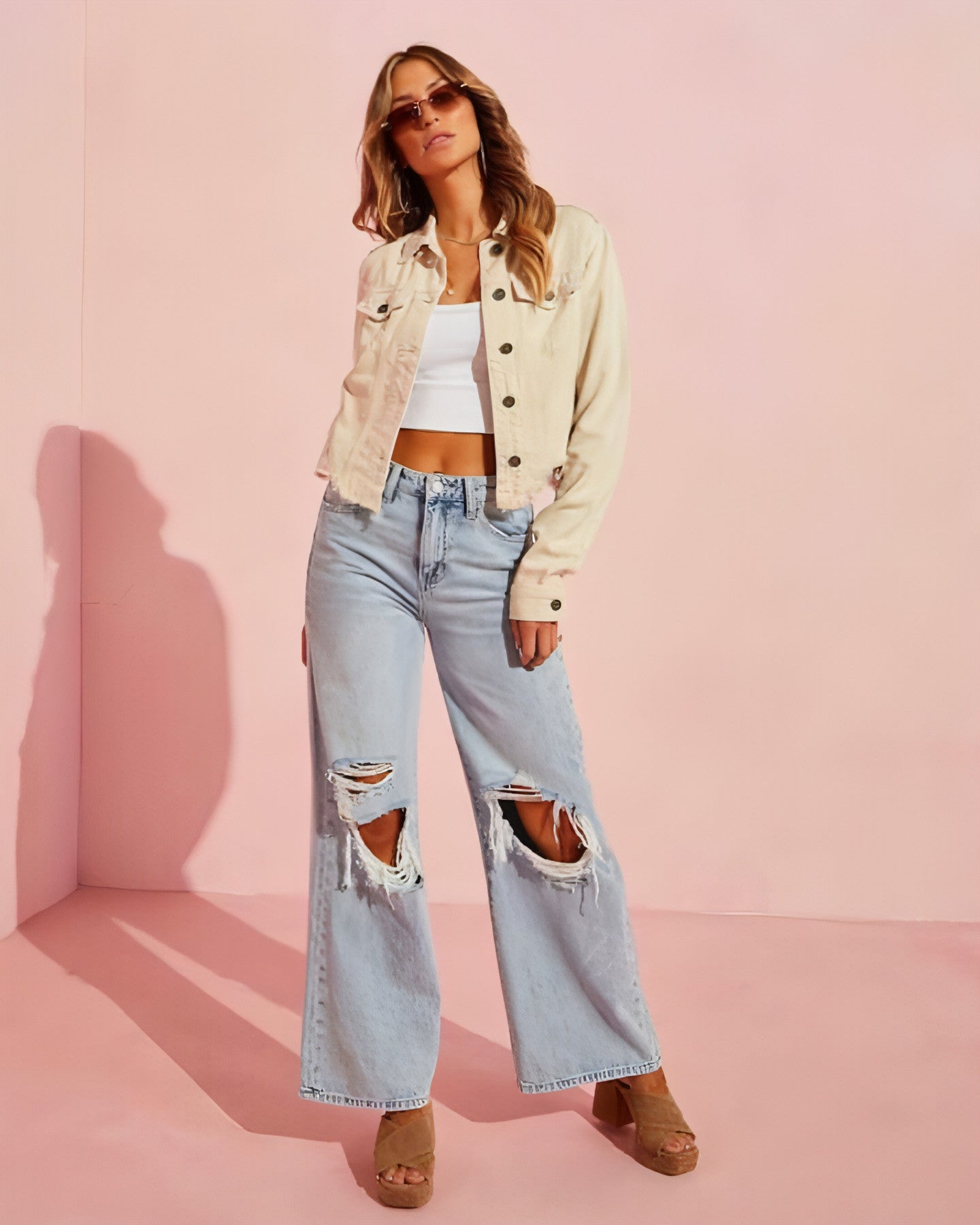 Carmine Juneberry ripped slimming jeans for women showcasing distressed details and slim fit design on model.