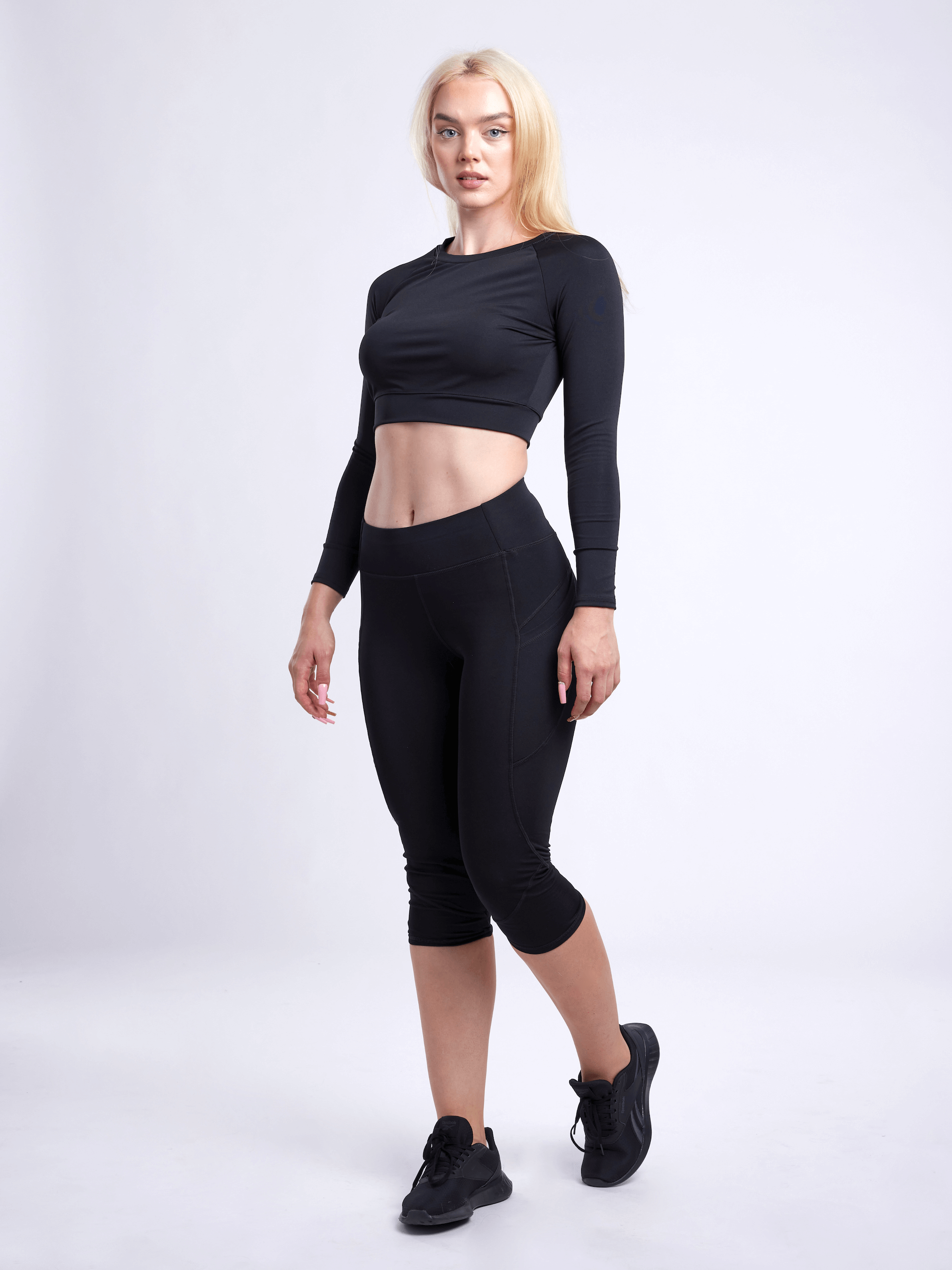 Black Lavender JupiterGear long-sleeve crop top for activewear, shown in black with fitted design and crew neckline.